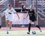 Lexi Dendis (3) of Hunterdon Central moves the ball past Shivani Howe (19) of Watchung Hills during the girls soccer game at Hunterdon Central Regional High School on 9/8/22.