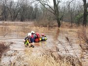 Rescuers pulled a stranded man from high waters off the Raritan River in Somerville, Somerset County, on Thursday morning.