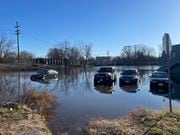 A parking lot off Route 23 on the banks of the Passaic River near the Willowbrook Mall remains flooded Wednesday morning, Dec. 20, 2023. The flooding was sparked by heavy rain from a strong coastal storm that hit New Jersey Sunday and Monday.