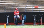 Rutgers offensive lineman Reggie Sutton (70) rides a bike on the side during practice at SHI Stadium on Thursday, August 22, 2019. 