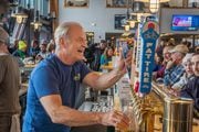 Actor Kelsey Grammer pours a beer while serving as a guest bartender at Belleayre Mountain Ski Center in Highmount, N.Y. on Sunday, Feb. 19, 2023. Grammer was promoting his Faith American Brewing Company, based in Upstate New York. Photo courtesy of Belleayre Mountain