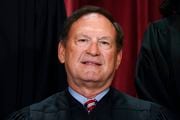FILE - Associate Justice Samuel Alito joins other members of the Supreme Court as they pose for a new group portrait, at the Supreme Court building in Washington, Oct. 7, 2022. Supreme Court justices tend to wipe the slate clean at the start of a new term, the bruised feelings occasioned by tough cases eased by a summer break. But this year, some justices are engaging in an extended and unusual public disagreement over the court's legitimacy that stems from the decision to overturn Roe v. Wade.(AP Photo/J. Scott Applewhite)